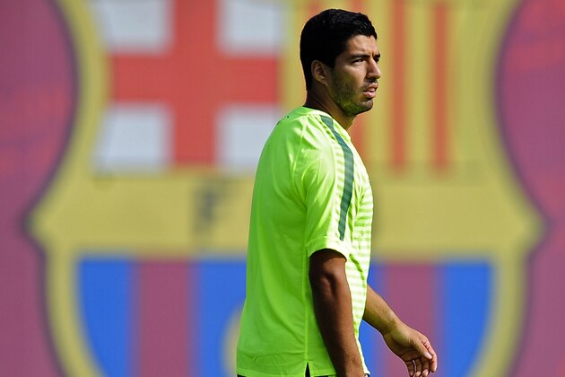 FC Barcelona's Luis Suarez attends a training session at the Sports Center FC Barcelona Joan Gamper in San Joan Despi, Spain, Tuesday, Sept. 16, 2014. FC Barcelona will play against Apoel in a group F Champions League on Wednesday Sept. 17. (AP Photo/Manu Fernandez)