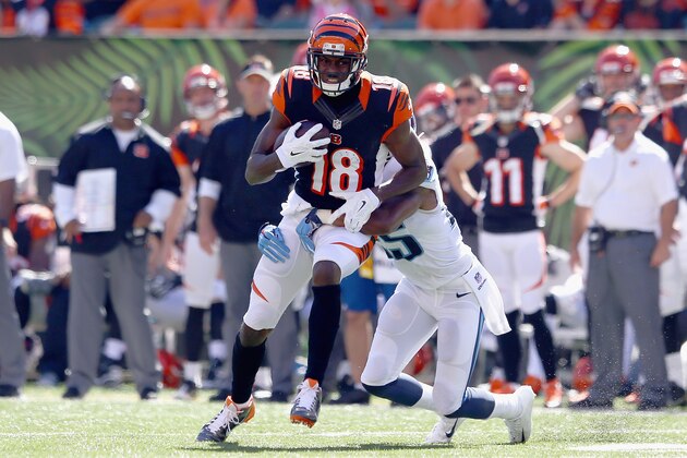 CINCINNATI, OH - SEPTEMBER 21:  A.J. Green #18 of the Cincinnati Bengals runs with the ball during the game against the Tennessee Titans at Paul Brown Stadium on September 21, 2014 in Cincinnati, Ohio.  (Photo by Andy Lyons/Getty Images)