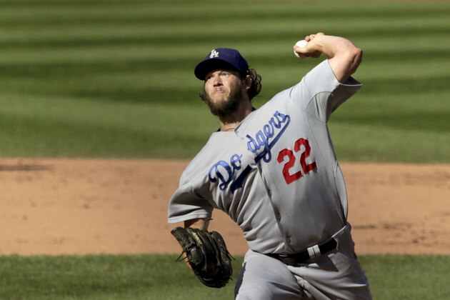 Los Angeles Dodgers starting pitcher Clayton Kershaw delivers during the fifth inning of a baseball game against the Chicago Cubs, Friday, Sept. 19, 2014, in Chicago. (AP Photo/Charles Rex Arbogast)