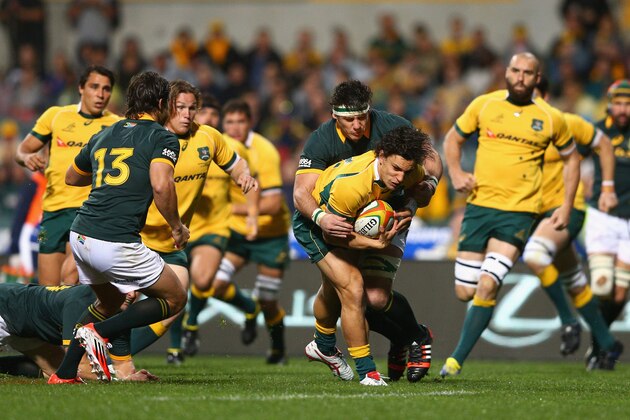 PERTH, AUSTRALIA - SEPTEMBER 06: Matt Toomua of the Wallabies is tackled during The Rugby Championship match between the Australian Wallabies and the South African Springboks at Patersons Stadium on September 6, 2014 in Perth, Australia.  (Photo by Cameron Spencer/Getty Images)