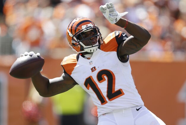 Cincinnati Bengals wide receiver Mohamed Sanu throws a 50-yard pass in the first half of an NFL football game against the Atlanta Falcons, Sunday, Sept. 14, 2014, in Cincinnati. (AP Photo/Michael Conroy)