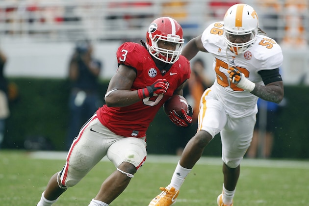 FILE - In this Sept. 29, 2012, file photo, Tennessee linebacker Curt Maggitt (56) chases Georgia running back Todd Gurley (3) during an NCAA college football game in Athens, Ga. Maggitt is cautiously optimistic that he will be ready for the start of the season as he comes back from a torn anterior cruciate ligament in his right knee. (AP Photo/John Bazemore, File)