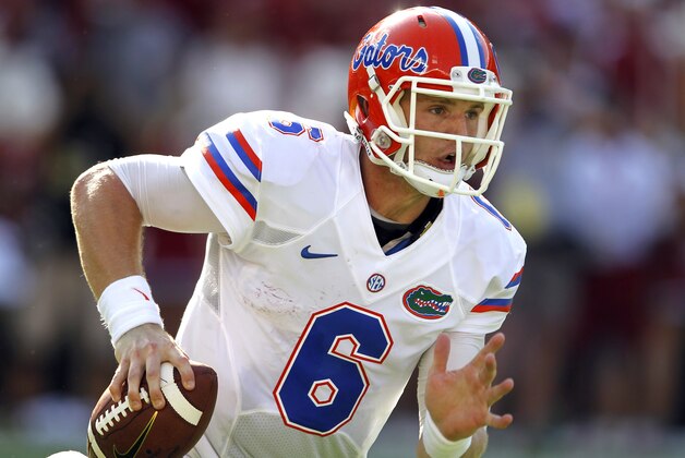 Florida quarterback Jeff Driskel (6) scrambles for yardage during the first half of an NCAA college football game against Alabama, Saturday, Sept. 20, 2014, in Tuscaloosa, Ala. (AP Photo/Butch Dill)