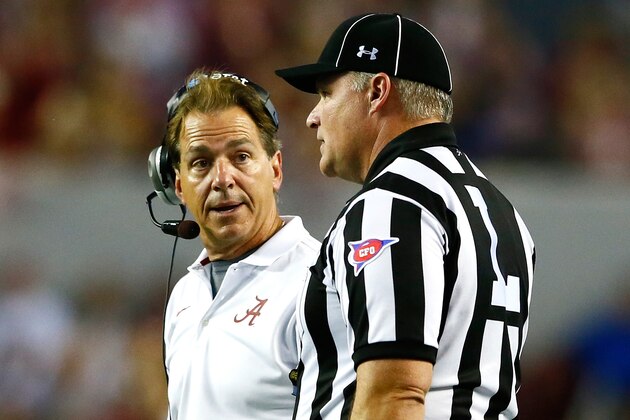 TUSCALOOSA, AL - SEPTEMBER 13:  Head coach Nick Saban of the Alabama Crimson Tide converses with line judge Michael Taylor during the game against the Southern Miss Golden Eagles at Bryant-Denny Stadium on September 13, 2014 in Tuscaloosa, Alabama.  (Photo by Kevin C. Cox/Getty Images)