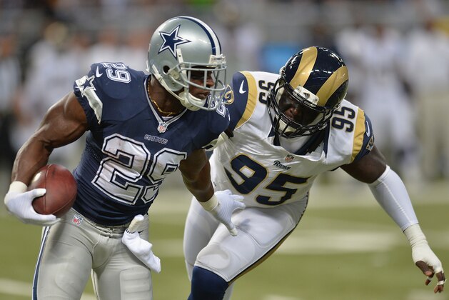 ST. LOUIS, MO - SEPTEMBER 21: William Hayes #95 of the St. Louis Rams tackles DeMarco Murray #29 of the Dallas Cowboys in the first quarter at the Edward Jones Dome on September 21, 2014 in St. Louis, Missouri.  (Photo by Michael B. Thomas/Getty Images)