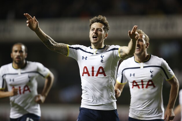 Tottenham Hotspur's Ryan Mason, centre, celebrates his goal against Nottingham Forest during an English League Cup soccer match at the White Hart Lane ground, in London, Wednesday, Sept. 24, 2014. (AP Photo/Lefteris Pitarakis)