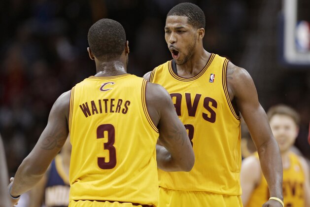 Cleveland Cavaliers' Tristan Thompson, right, from Canada, celebrates with Dion Waiters during an NBA basketball game against the Indiana Pacers Sunday, Jan. 5, 2014, in Cleveland. (AP Photo/Tony Dejak)