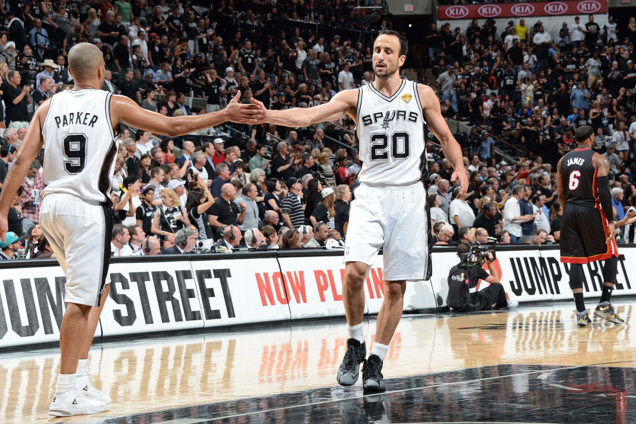 SAN ANTONIO, TX - JUNE 15: Tony Parker #9 and Manu Ginobili #20 of the San Antonio Spurs high five during Game Five of the 2014 NBA Finals between the Miami Heat and San Antonio Spurs at AT&T Center on June 15, 2014 in San Antonio, Texas. NOTE TO USER: User expressly acknowledges and agrees that, by downloading and/or using this photograph, user is consenting to the terms and conditions of the Getty Images License Agreement.  Mandatory Copyright Notice: Copyright 2014 NBAE (Photo by Andrew D Bernstein/NBAE via Getty Images)