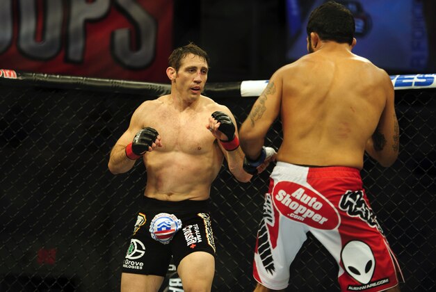 Nov 6, 2013; Fort Campbell, KY, USA; Tim Kennedy (red gloves) fights Rafael Natal (blue gloves) in the middleweight bout during UFC Fight for the Troops at Fort Campbell. Mandatory Credit: Joshua Lindsey-USA TODAY Sports