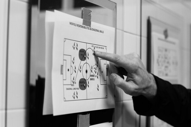 SYDNEY, AUSTRALIA - AUGUST 19:  (EDITORS NOTE: Image has been shot in black and white. Color version not available.) Hakoah Sydney City East assistant coach, Donato D'Agrosa speaks tactics with his players prior to the FFA Cup match against the Palm Beach Sharks at Hensley Athletic Field on August 19, 2014 in Sydney, Australia. Hakoah Sydney City East, founded in 1939 and one of the foundation members of the former National Soccer League, will compete in the inaugural FFA Cup tournament marking its return to a national competition for 27 years.  (Photo by Brendon Thorne/Getty Images)