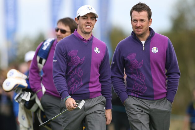 Europe’s Rory McIlroy, left, and Graeme McDowell walk up to the 18th green during a practice round ahead of the Ryder Cup golf tournament at Gleneagles, Scotland, Wednesday, Sept. 24, 2014. (AP Photo/Peter Morrison)