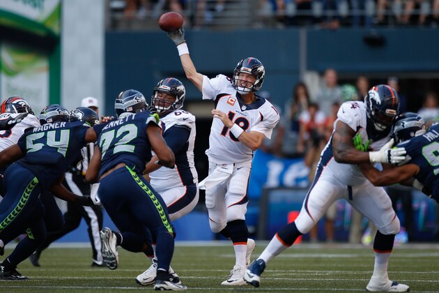 SEATTLE, WA - SEPTEMBER 21:  Quarterback Peyton Manning #18 of the Denver Broncos passes against the Seattle Seahawks at CenturyLink Field on September 21, 2014 in Seattle, Washington. The Seahawks defeated the Broncos 26-20 in overtime.  (Photo by Otto Greule Jr/Getty Images)