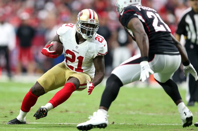 GLENDALE, AZ - SEPTEMBER 21: Running back Frank Gore #21 of the San Francisco 49ers runs up field against cornerback Patrick Peterson #21 of the Arizona Cardinals during the NFL game at the University of Phoenix Stadium on September 21, 2014 in Glendale, Arizona.  (Photo by Christian Petersen/Getty Images)