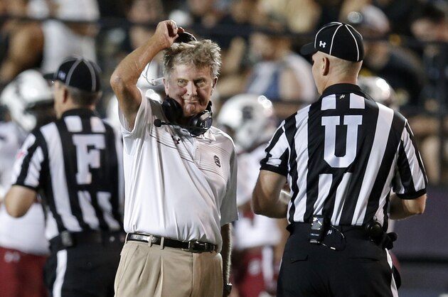 South Carolina head coach Steve Spurrier talks with umpire Tom Quick, right, during the second quarter of an NCAA college football game against Vanderbilt Saturday, Sept. 20, 2014, in Nashville, Tenn. (AP Photo/Mark Humphrey)