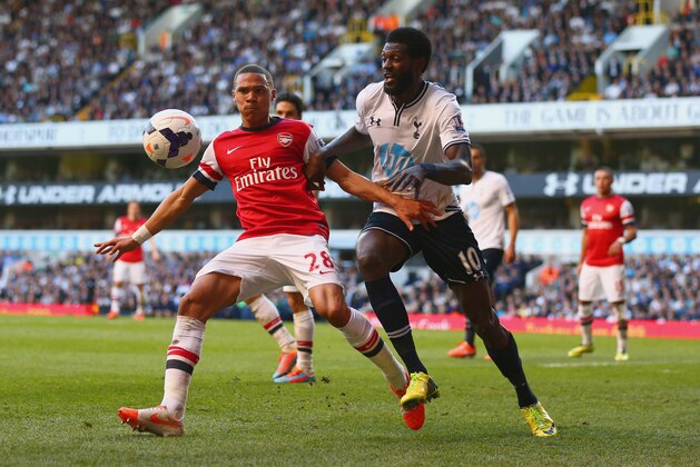 LONDON, ENGLAND - MARCH 16:  Kieran Gibbs of Arsenal and Emmanuel Adebayor of Tottenham Hotspur battle for the ball during the Barclays Premier League match between Tottenham Hotspur and Arsenal at White Hart Lane on March 16, 2014 in London, England.  (Photo by Paul Gilham/Getty Images)
