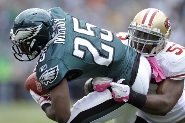 Philadelphia Eagles running back LeSean McCoy (25) is tackled by San Francisco 49ers inside linebacker NaVorro Bowman (53) in the first half of an NFL football game Sunday, Oct. 2, 2011, in Philadelphia. (AP Photo/Michael Perez)