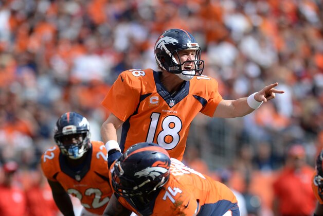 Sep 14, 2014; Denver, CO, USA; Denver Broncos quarterback Peyton Manning (18) audibles in the second quarter against the Kansas City Chiefs at Sports Authority Field at Mile High. Mandatory Credit: Ron Chenoy-USA TODAY Sports