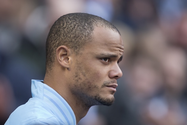 Manchester City's Vincent Kompany takes to the pitch for his team's English Premier League soccer match against Newcastle at The Etihad Stadium, Manchester, England, Saturday March 30, 2013. (AP Photo/Jon Super)