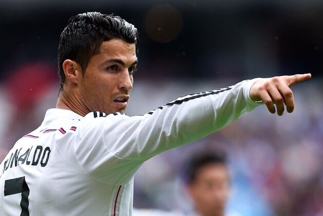 LA CORUNA, SPAIN - SEPTEMBER 20:  Cristiano Ronaldo of Real Madrid CF reacts during the La Liga match between RC Deportivo La Coruna and Real Madrid CF at Riazor Stadium on September 20, 2014 in La Coruna, Spain.  (Photo by David Ramos/Getty Images)