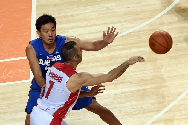INCHEON, SOUTH KOREA - SEPTEMBER 25: Jeffrei Allan Chan of the Philippines challenges Mahdi Kamrani of Iran during the Basketball Mens Pleliminary round match between Iran and the Philippines during day five of the 2014 Asian Games at Hwaseong Sports Complex Gymnasium on September 25, 2014 in Incheon, South Korea. (Photo by Stanley Chou/Getty Images) INCHEON, SOUTH KOREA - SEPTEMBER 25: Jeffrei Allan Chan of the Philippines challenges Mahdi Kamrani of Iran during the Basketball Mens Pleliminary round match between Iran and the Philippines during day five of the 2014 Asian Games at Hwaseong Sports Complex Gymnasium on September 25, 2014 in Incheon, South Korea. (Photo by Stanley Chou/Getty Images)