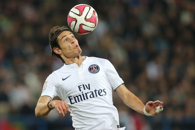 Paris Saint Germain's Edinson Cavani plays with the ball during his League One soccer match against Caen, in Caen, western France, Wednesday, Sept. 24, 2014. (AP Photo/David Vincent)