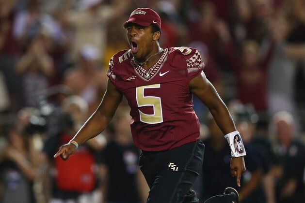 TALLAHASSEE, FL - SEPTEMBER 20:  Jameis Winston #5 of the Florida State Seminoles runs on the field to celebrate the overtime win against the Clemson Tigers at Doak Campbell Stadium on September 20, 2014 in Tallahassee, Florida.  (Photo by Ronald Martinez/Getty Images)