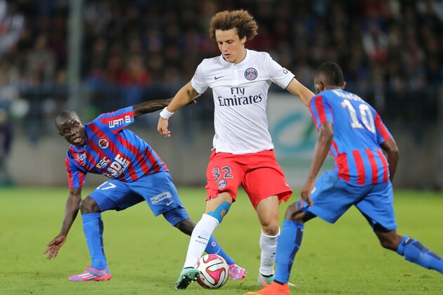 Paris Saint Germain's defender David Luiz of Brazil challenges for the ball with Caen's midfielder Ngolo Kante, left, and Lenny Nangis during his League One soccer match against Caen, in Caen, western France, Wednesday, Sept. 24, 2014. Paris SG won 2-0. (AP Photo/David Vincent)
