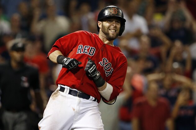 Boston Red Sox's Dustin Pedroia watches a long fly ball near the foul pole during the 10th inning of their 9-8 win over the Toronto Blue Jays in a baseball game at Fenway Park in Boston Friday, Sept. 5, 2014. (AP Photo/Winslow Townson)