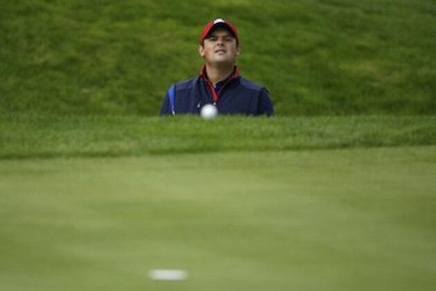Patrick Reed of the US looks out of a bunker after playing onto the 14th green during a practice round ahead of the Ryder Cup golf tournament at Gleneagles, Scotland, Thursday, Sept. 25, 2014. (AP Photo/Matt Dunham)