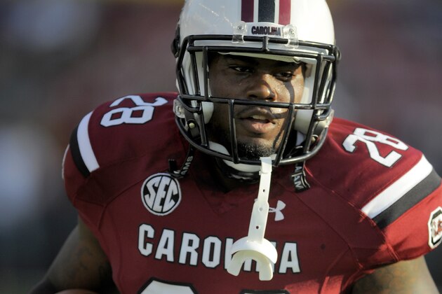 South Carolina Gamecocks running back Mike Davis (28) runs the ball during pre-game warm up of an NCAA college football game against the East Carolina Pirates, Saturday, Sept. 6, 2014, in Columbia, S.C. (AP Photo/Stephen B. Morton)