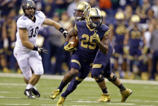 Notre Dame running back Tarean Folston rushes against Purdue during the first half of an NCAA college football game in Indianapolis, Saturday, Sept. 13, 2014. (AP Photo/Michael Conroy)