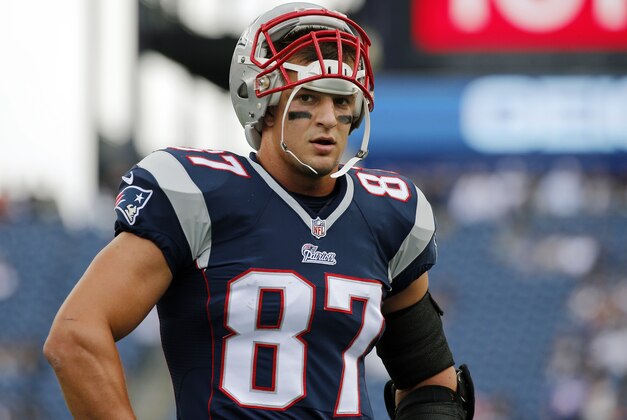 New England Patriots tight end Rob Gronkowski pauses during warm-up's before an NFL football game against the Oakland Raiders Sunday, Sept. 21, 2014, in Foxborough, Mass. (AP Photo/Elise Amendola)