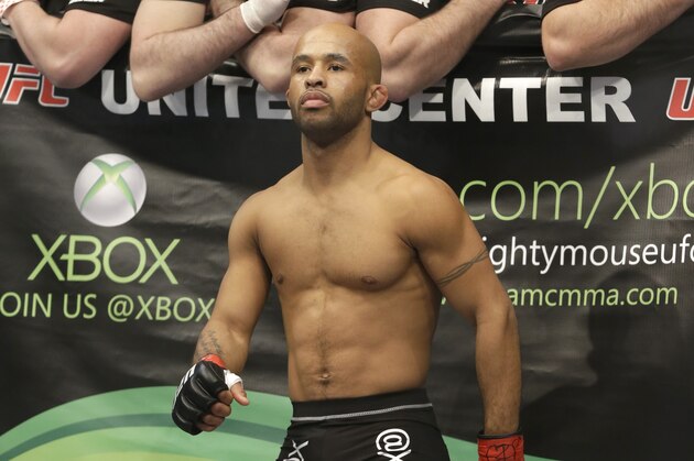 Demetrious Johnson stands in the ring before fighting with John Dodson during UFC World Flyweight Championship on FOX 6 at the United Center in Chicago, Saturday, Jan. 26, 2013. Johnson won the bout. (AP Photo/Nam Y. Huh)