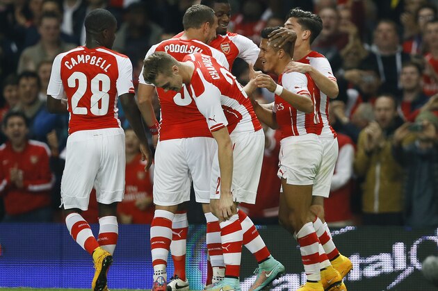 Arsenal's players celebrate the goal of Alexis Sanchez, right, during the English League Cup soccer match between Arsenal and Southampton at Emirates Stadium in London, Tuesday, Sept. 23, 2014. (AP Photo/Kirsty Wigglesworth) Arsenal's players celebrate the goal of Alexis Sanchez, right, during the English League Cup soccer match between Arsenal and Southampton at Emirates Stadium in London, Tuesday, Sept. 23, 2014. (AP Photo/Kirsty Wigglesworth)