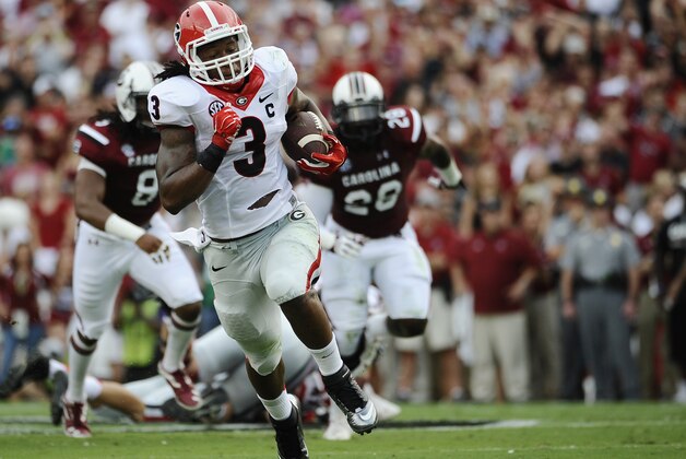 Georgia running back Todd Gurley (3) runs for a touchdown during the first half of an NCAA college football game against South Carolina on Saturday, Sept. 13, 2014, in Columbia, S.C. The touchdown as called back because of a holding penalty on Georgia. (AP Photo/Rainier Ehrhardt)