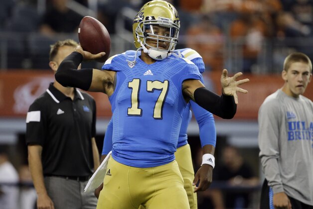UCLA quarterback Brett Hundley warms up before an NCAA college football game against Texas, Saturday, Sept. 13, 2014, in Arlington, Texas. (AP Photo/Tony Gutierrez)