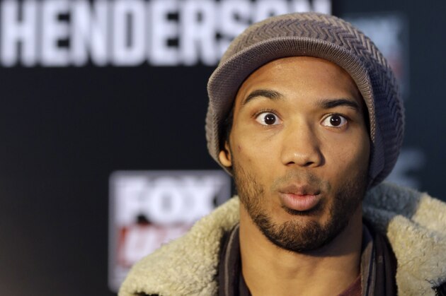 Mixed martial Arts fighter Benson Henderson talks with reporters during a media availability at the United Center for his upcoming UFC fight, Thursday, Jan. 23, 2014, in Chicago. Henderson will face off against Josh Thomson on Saturday, Jan. 25, 2014. (AP Photo/Nam Y. Huh)