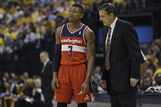 Washington Wizards head coach Randy Wittman talks with Bradley Beal (3) during the first half of game 5 of the Eastern Conference semifinal NBA basketball playoff series against the Indiana Pacers Tuesday, May 13, 2014, in Indianapolis. (AP Photo/Darron Cummings)