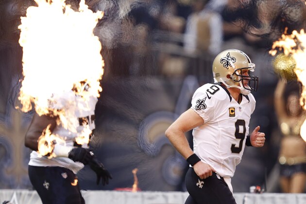 New Orleans Saints quarterback Drew Brees (9) runs on the field before an NFL football game against the Minnesota Vikings in New Orleans, Sunday, Sept. 21, 2014. (AP Photo/Rogelio Solis)