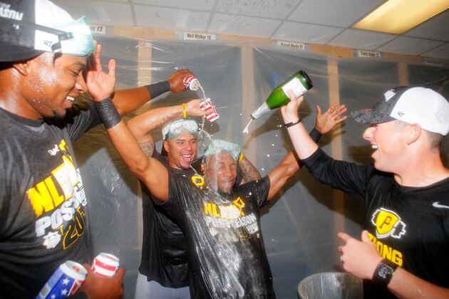 ATLANTA, GA - SEPTEMBER 23:  Gregory Polanco #25, Jose Tabata #31, and Starling Marte #6  of the Pittsburgh Pirates celebrate clinching a National League playoff spot after their 3-2 win over the Atlanta Braves at Turner Field on September 23, 2014 in Atlanta, Georgia.  (Photo by Kevin C. Cox/Getty Images)