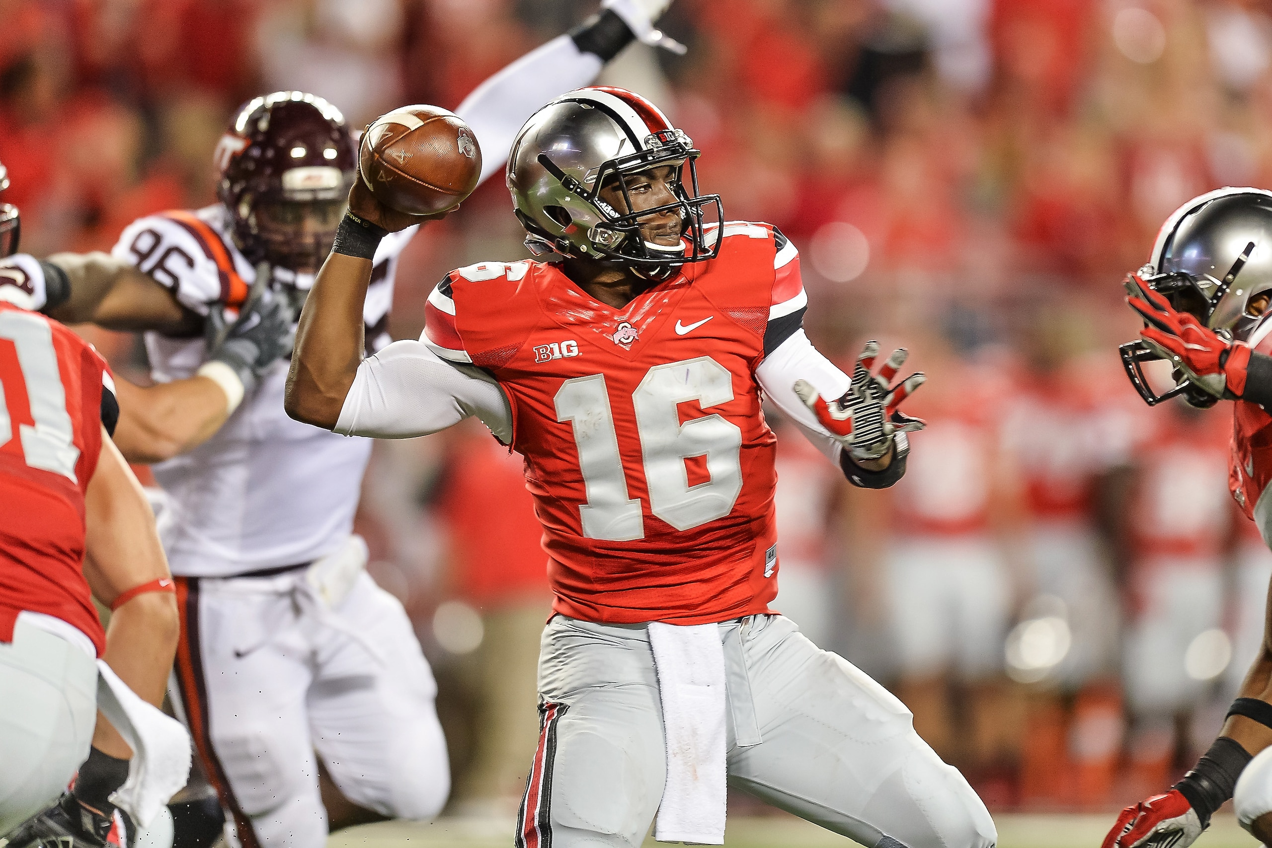 COLUMBUS, OH - SEPTEMBER 6:  Quarterback J.T. Barrett #16 of the Ohio State Buckeyes passes against the Virginia Tech Hokies at Ohio Stadium on September 6, 2014 in Columbus, Ohio.  (Photo by Jamie Sabau/Getty Images)