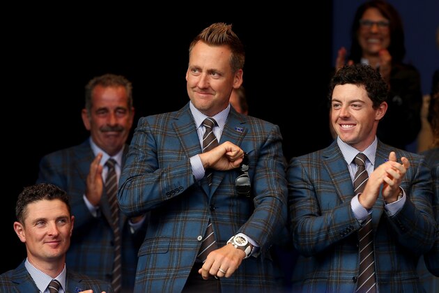 AUCHTERARDER, SCOTLAND - SEPTEMBER 25:  Ian Poulter of Europe (C) acknowledges the crowd alongside Justin Rose (L) and Rory McIlroy (R) as he is introduced during the Opening Ceremony ahead of the 40th Ryder Cup at Gleneagles on September 25, 2014 in Auchterarder, Scotland.  (Photo by Andrew Redington/Getty Images)