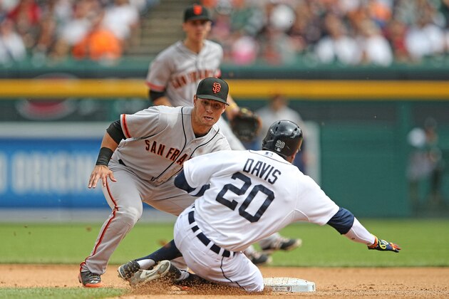 DETROIT, MI - SEPTEMBER 06: Joe Panik #12 of the San Francisco Giants tags out Rajai Davis #20 of the Detroit Tigers on a steal attempt during the fourth inning of the game at Comerica Park on September 6, 2014 in Detroit, Michigan.  (Photo by Leon Halip/Getty Images)