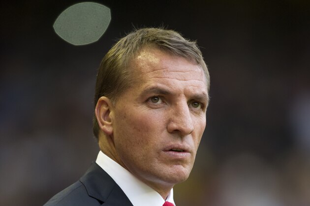 Liverpool's manager Brendan Rodgers takes to the touchline before his team's English Premier League soccer match against Aston Villa at Anfield Stadium, Liverpool, England, Saturday Sept. 13, 2014. (AP Photo/Jon Super)