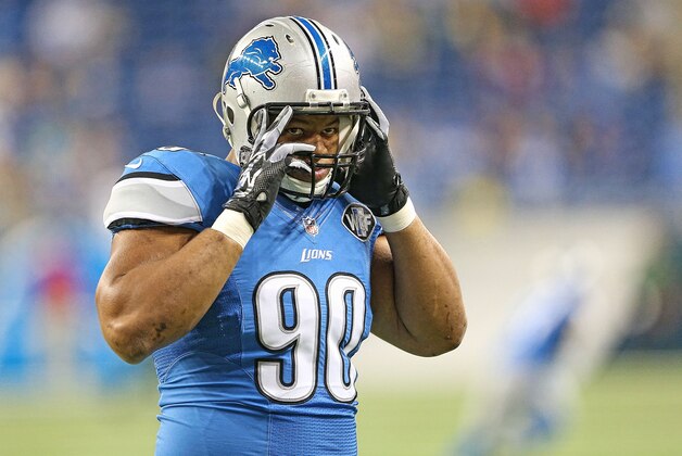 DETROIT, MI - SEPTEMBER 21:  Ndamukong Suh #90 of the Detroit Lions warms up prior to the start of the game against the Green Bay Packers at Ford Field on September 21, 2014 in Detroit, Michigan. The Lions defeated the Packers 19-7.  (Photo by Leon Halip/Getty Images)