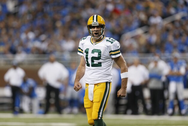 Green Bay Packers quarterback Aaron Rodgers yells at teammates during the first half of an NFL football game against the Detroit Lions in Detroit, Sunday, Sept. 21, 2014. (AP Photo/Paul Sancya)