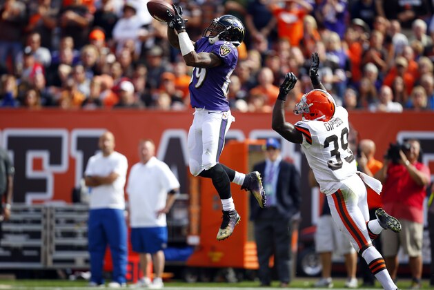 Baltimore Ravens wide receiver Steve Smith (89) makes a catch in front of Cleveland Browns free safety Tashaun Gipson (39) during an NFL game at the FirstEnergy Stadium in Cleveland on Sunday, Sept. 21, 2014. (Jeff Haynes/AP Images for Panini)