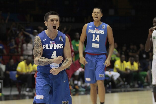 Jim Alapag of the Philippines celebrates after winning the Group B Basketball World Cup match against Senegal in Seville, Spain, Thursday, Sept. 4, 2014. The 2014 Basketball World Cup competition will take place in various cities in Spain from Aug. 30 through to Sept. 14. (AP Photo/Miguel Angel Morenatti)