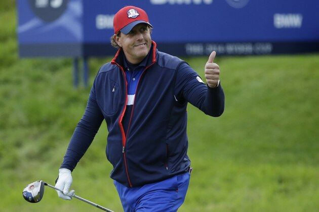 Phil Mickelson of the US gives a thumbs up as he walks off the 9th tee box during a practice round for the Ryder Cup, at Gleneagles, Scotland, Thursday, Sept. 25, 2014. (AP Photo/Matt Dunham)
