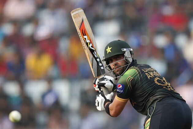 Pakistan's batsman Umar Akmal plays a shot during their ICC Twenty20 Cricket World Cup match against Australia in Dhaka, Bangladesh, Sunday, March 23, 2014. (AP Photo/Aijaz Rahi)
